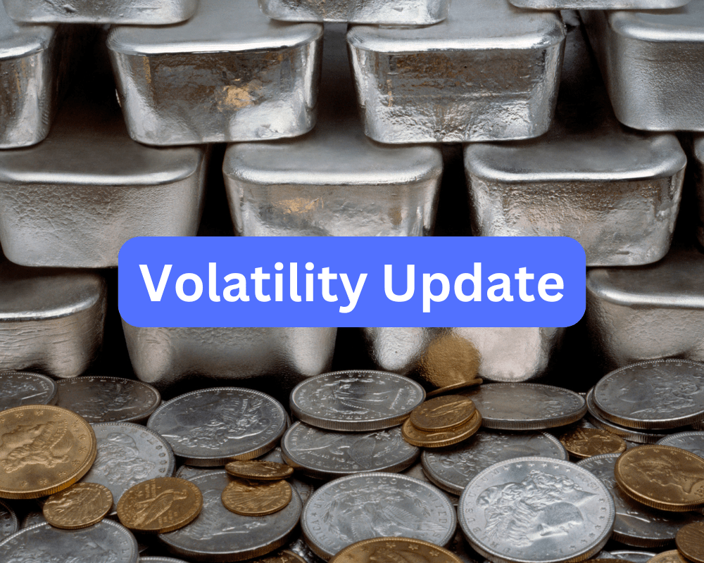 Pile of silver bars and gold coins