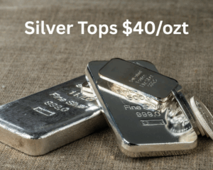 stack of silver bars with text reading "silver tops $40/ozt"